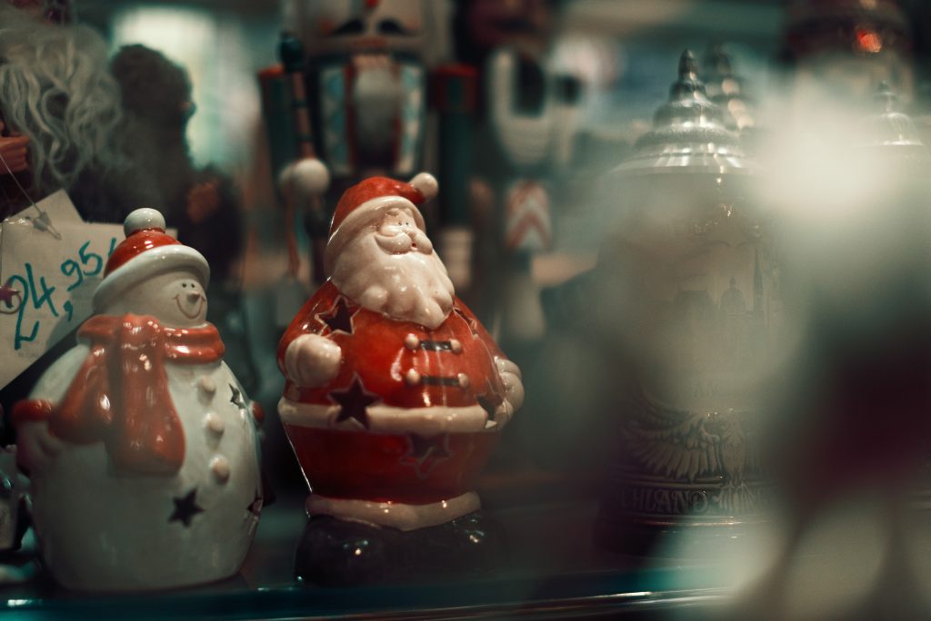 Santa Claus and Snowman on a gift shop display in Aachen. Photo taken in August 2022